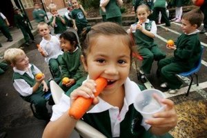 Child eating carrot