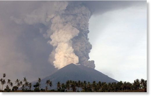 A view of the Mount Agung volcano erupting in Karangasem, Bali, on Monday