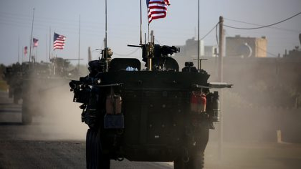 A convoy of US forces armored vehicles near the northern Syrian city of Manbij