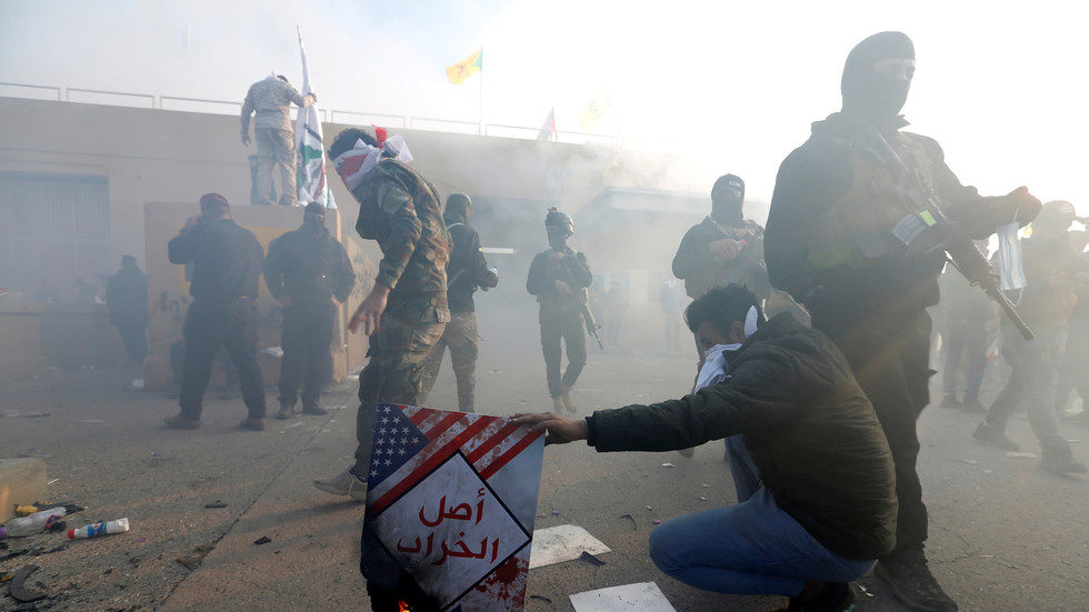 Militant protesters besiege the main gate of the US Embassy in Baghdad