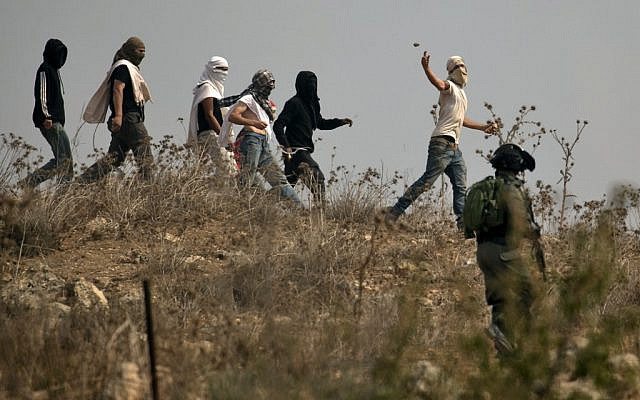 Settlers attack Palestinian protesters