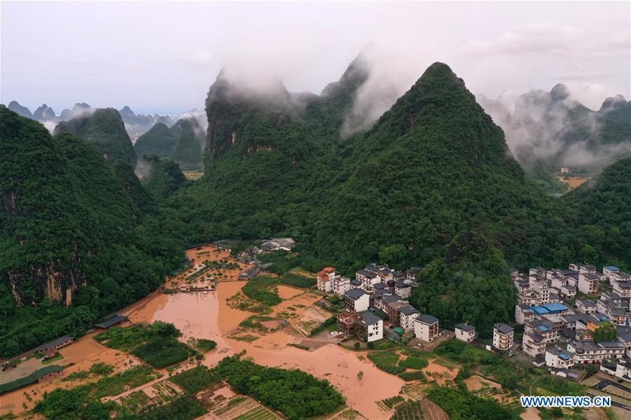 Aerial photo taken on June 7, 2020 shows a village hit by flood caused by downpour in Yangshuo of Guilin, south China's Guangxi Zhuang Autonomous Region.