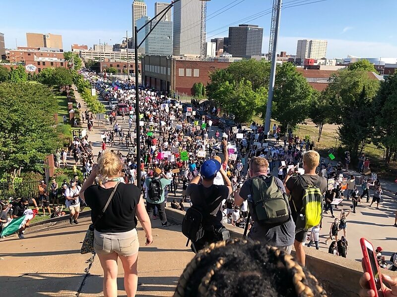 Armed protesters march for reparations in Tulsa, Oklahoma as the city