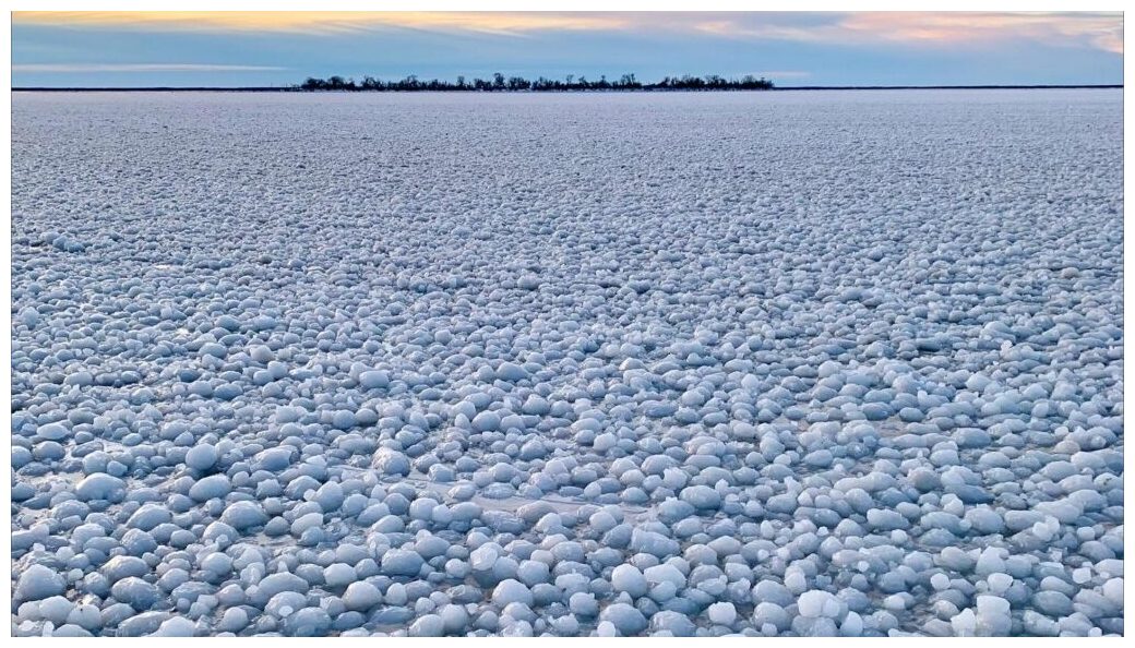 I have never seen anything like it': Strange weather phenomenon leaves Lake  Manitoba covered in ice balls