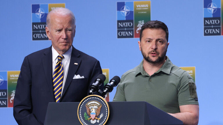 FILE PHOTO: Ukrainian President Vladimir Zelensky (R) speaks at the announcement of the G7 nations' joint declaration for the support of Ukraine as US President Joe Biden