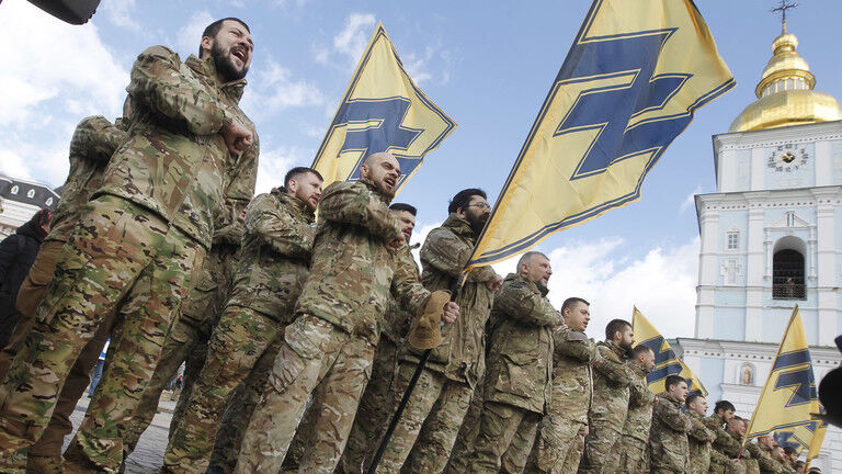 FILE PHOTO. Azov Battalion with flag