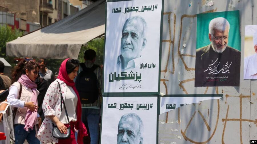 electoral posters of moderate candidate Masud Pezeshkian (left) and hard-line hopeful Saeed Jalili in Tehran.