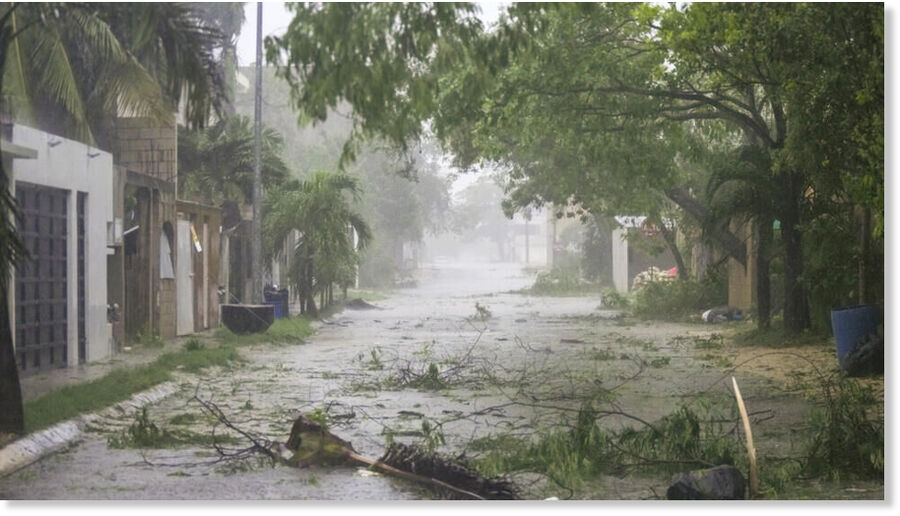 Torn-off branches cover a Tulum street as Hurricane Beryl passes through Mexico, on July 5, 2024.