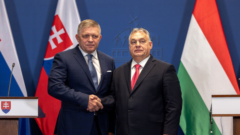 FILE PHOTO: Slovak Prime Minister Robert Fico shakes hands with his Hungarian counterpart Viktor Orban, January 16, 2024