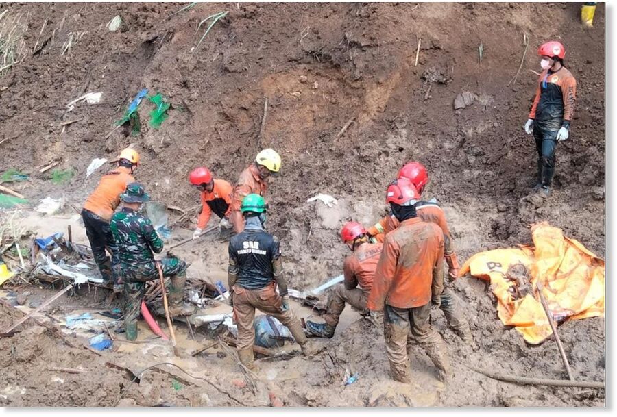 Rescue workers search for victims