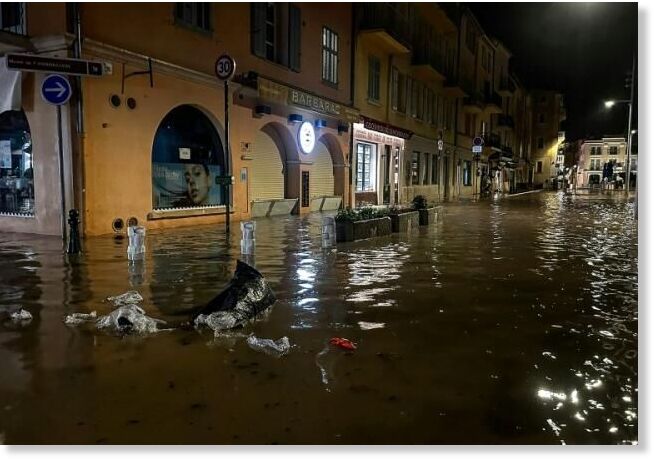 Floodwater lapped at the shopfronts