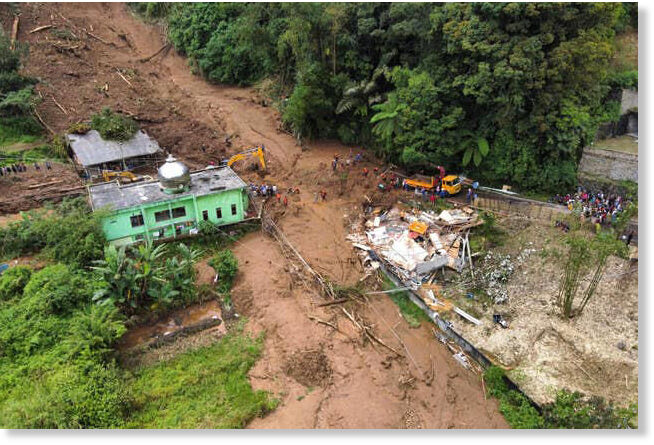 Rescuers search for victims after a landslide