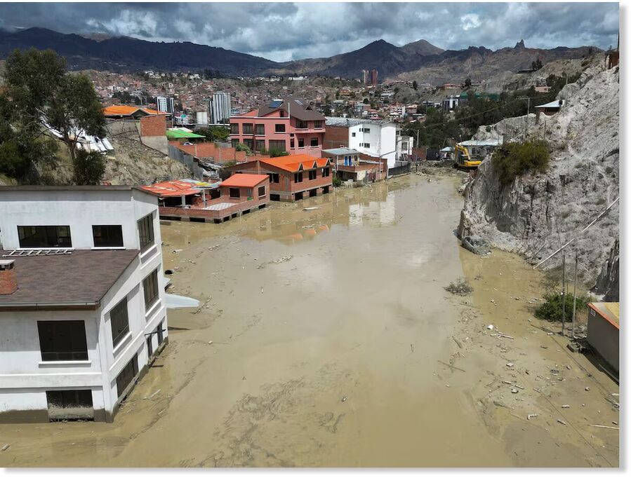 Homes are flooded by the overflowing Pasajahuira River in La Paz, Bolivia