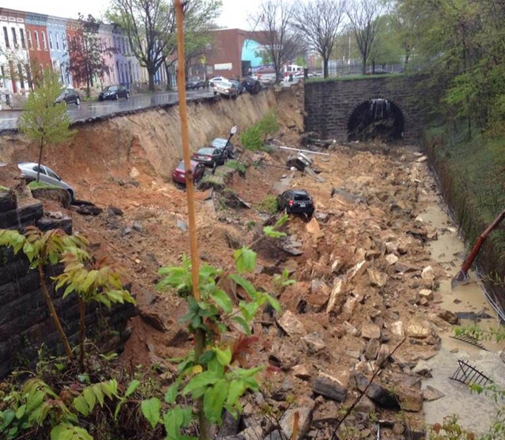 Sinkhole or landslide? Block-long street collapse in Baltimore 